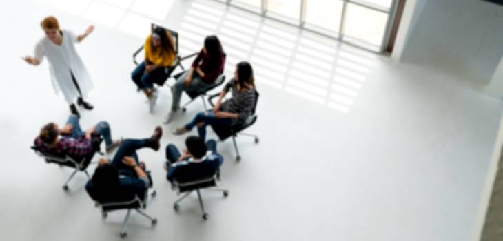 Group of employees receiving sexual harassment training at work